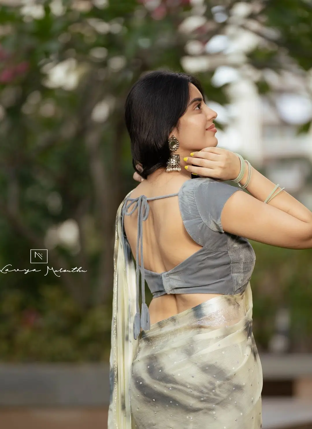 Navya Marouthu Wearing White Saree Sleeveless Black Blouse